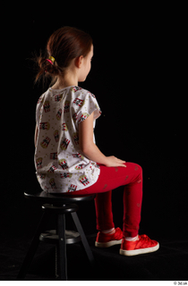 Lilly  1 dressed red leggings red shoes sitting t…